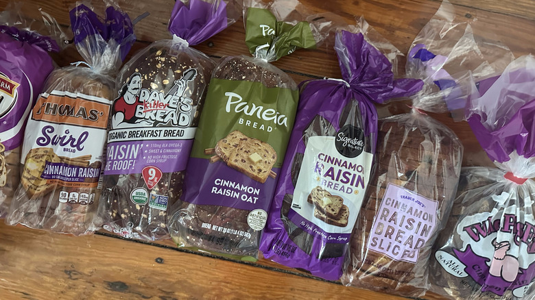Various cinnamon raisin bread loaves on wooden background