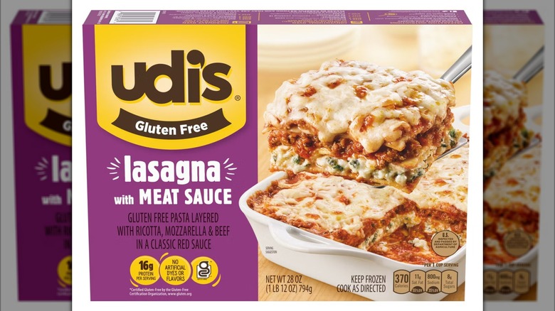 Box of Udi's gluten free lasagna with meat sauce, image of prepared lasagna being scooped out of dish on front