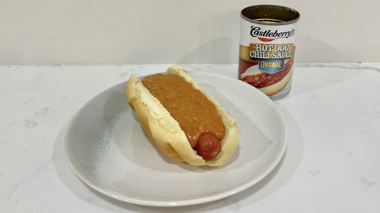 Castleberry's hot dog chili sauce on hot dog.