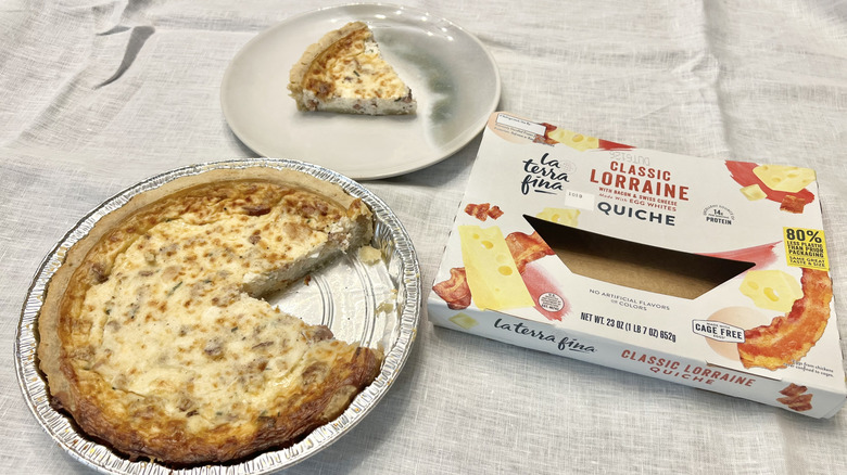La Terra Fina Lorraine Quiche with slice missing.