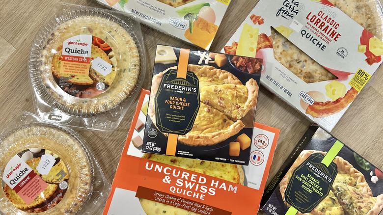 8 different kinds of store-bought quiches in boxes.