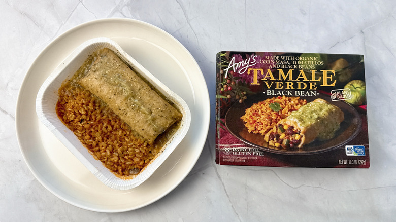 tamale meal on a plate with boxed packaging alongside