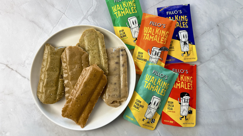 tamales on a plate and packets of tamales