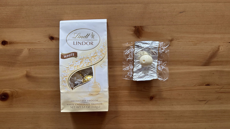 Lindt Lindor White Chocolate Truffles on wooden table