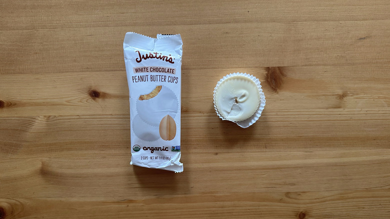 Justin's White Chocolate Peanut Butter Cups on wooden table