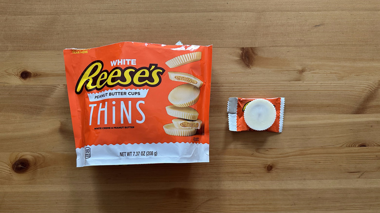 Reese's White Peanut Butter Cups Thins on wooden table