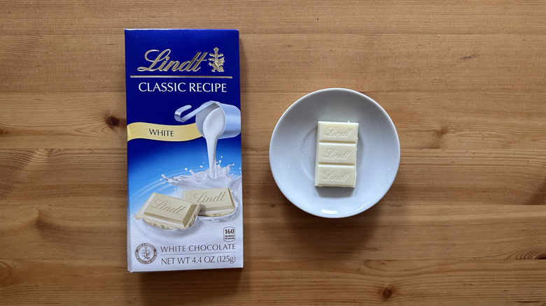 Lindt Classic Recipe White Chocolate on wooden table