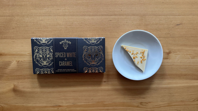 Omnom Spiced White and Caramel Bar on wooden table