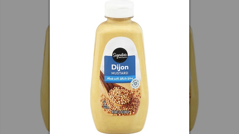 Bottle of Signature Select Dijon Mustard.
