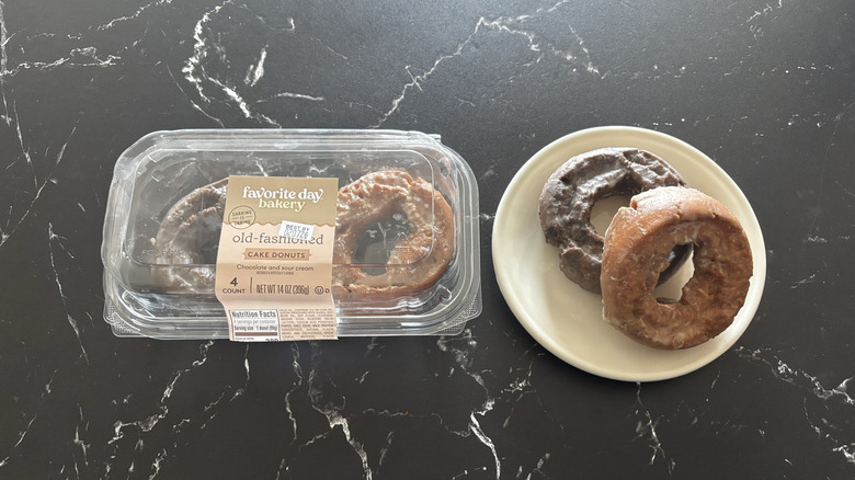 Favorite day cake donuts package next to donuts on plate