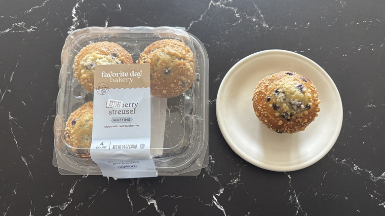 Favorite Day blueberry streusel muffin package next to muffin on plate
