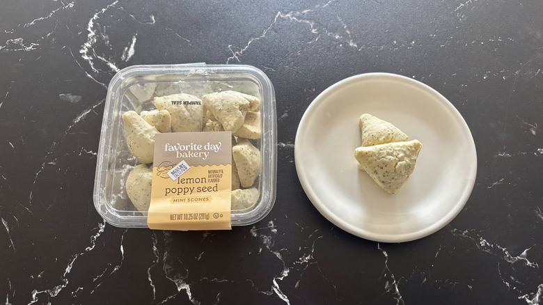 Favorite Day lemon poppyseed mini scones container next to mini scones on plate