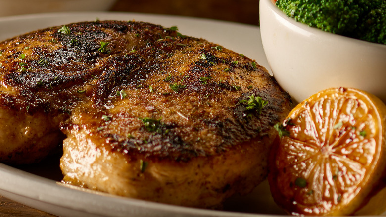 Product image of the herb-crusted chicken dish from Texas Roadhouse