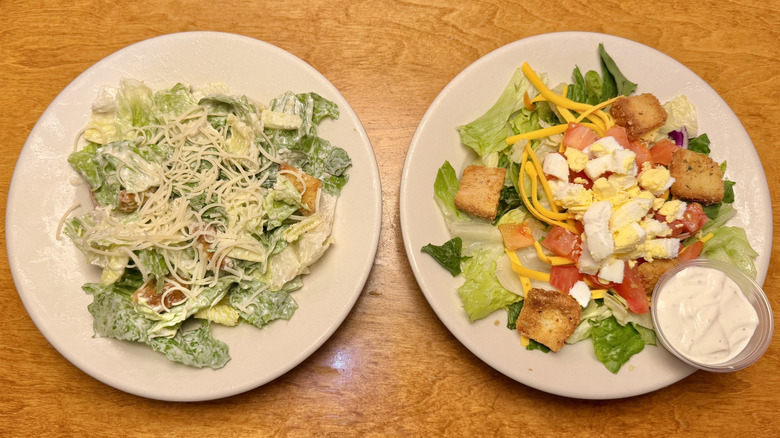 Caesar and House Salads on a table