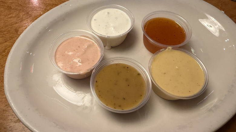 Various salad dressings on a plate