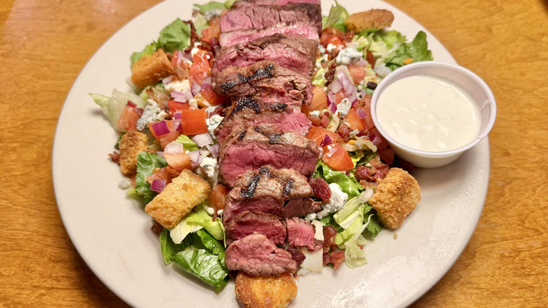 Steakhouse Filet Salad with sliced meat and blue cheese