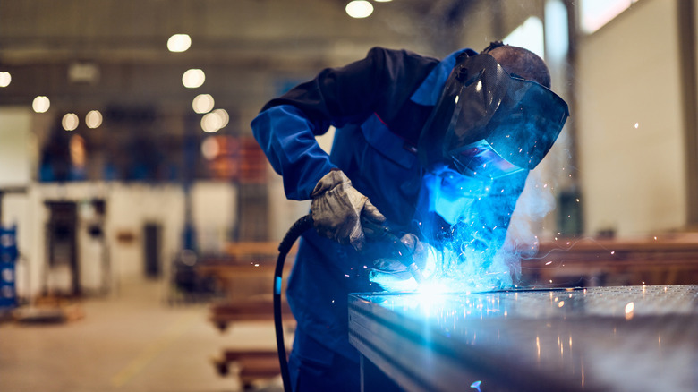 welder creating stainless steel countertops