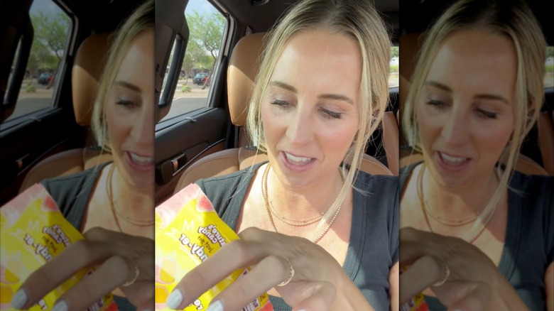 Angela Ackerman of @costcoguide eats candy in car