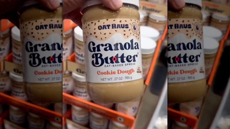 hand holding Granola Butter mirrored image