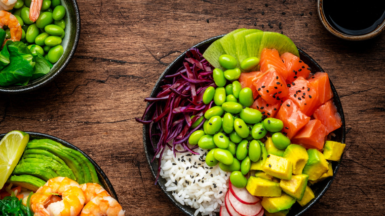 Poke bowls with contrasting colorful toppings.