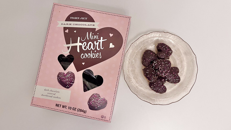 Dark chocolate heart cookies on table