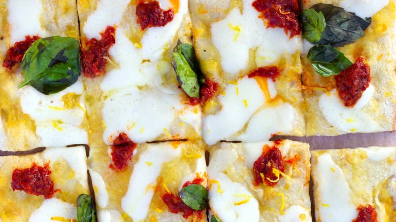 Pizza cut into rectangular slices, topped with 'nduja