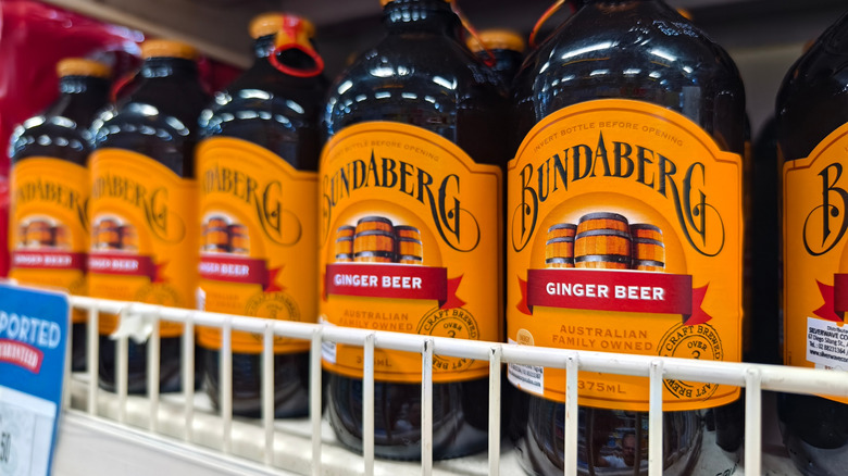 Close-up of row of bottles of Bundaberg ginger beer on shelf