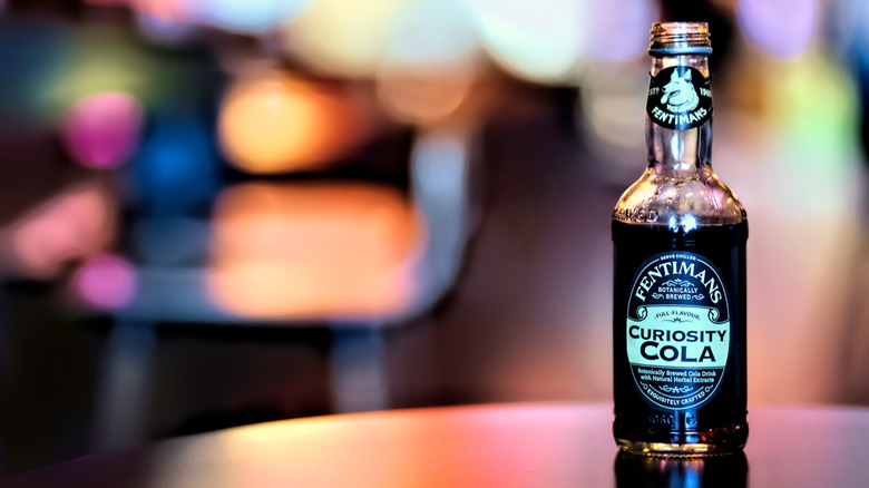 Bottle of Fentiman's Curiosity Cola against dark background