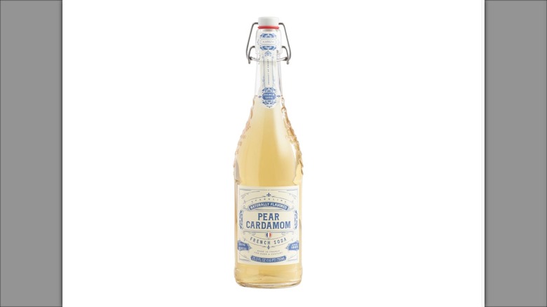Bottle of World Market Pear Cardamom French Soda on white background
