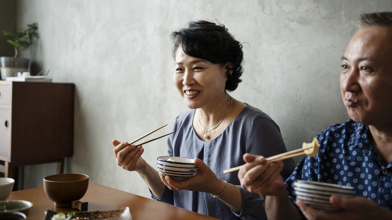 Older couple eating at restaurant