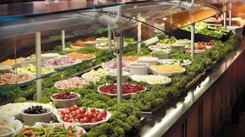 Salad bar with vegetables and other toppings