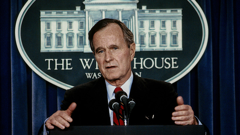 President George H.W. Bush answering reporters' questions in the White House's press briefing room