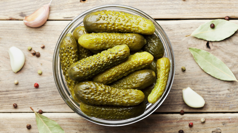 Pickles in bowl on wooden rustic table