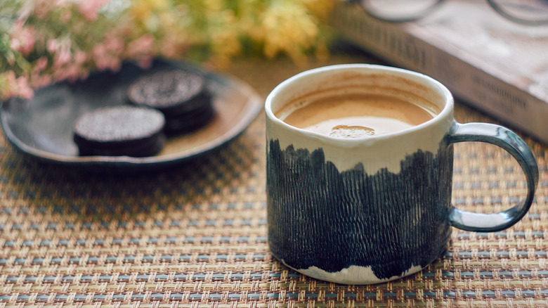 Blue patterned coffee mug filled with coffee