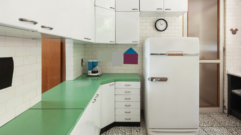 retro white kitchen with white fridge and green Formica countertop