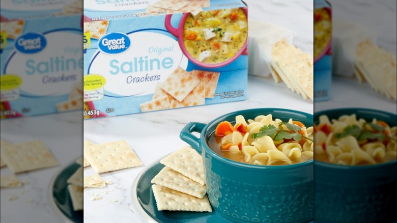 Bowl of noodle soup served with saltines, box in background