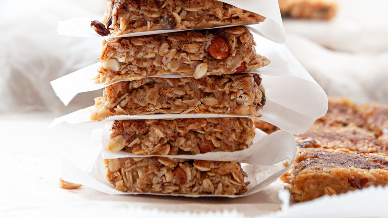 Stack of granola bars with wax paper between each