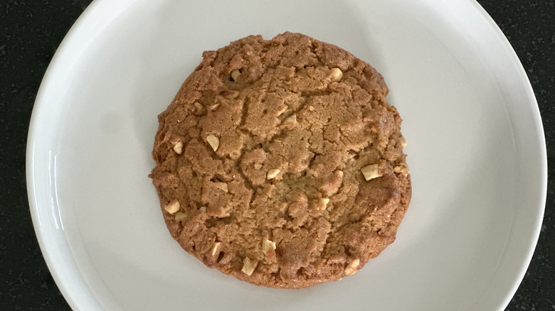 Overhead image of white plate with peanut butter cookie