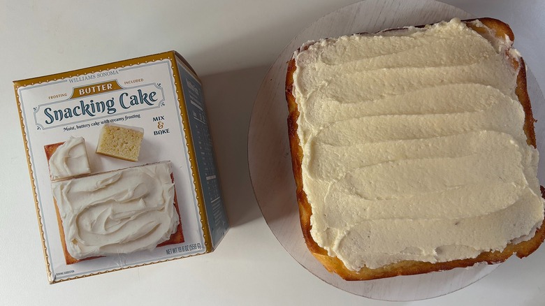 Box of Williams Sonoma Butter snacking cake mix next to butter snacking cake on white table