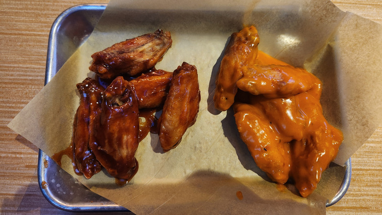Barbecue and buffalo chicken wings on tray from Buffalo Wild Wings