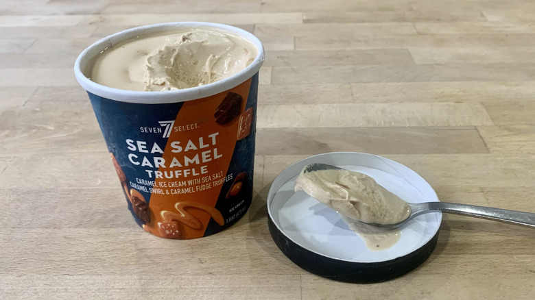 opened Sea Salt Caramel Truffle pint with spoonful of ice cream next to it