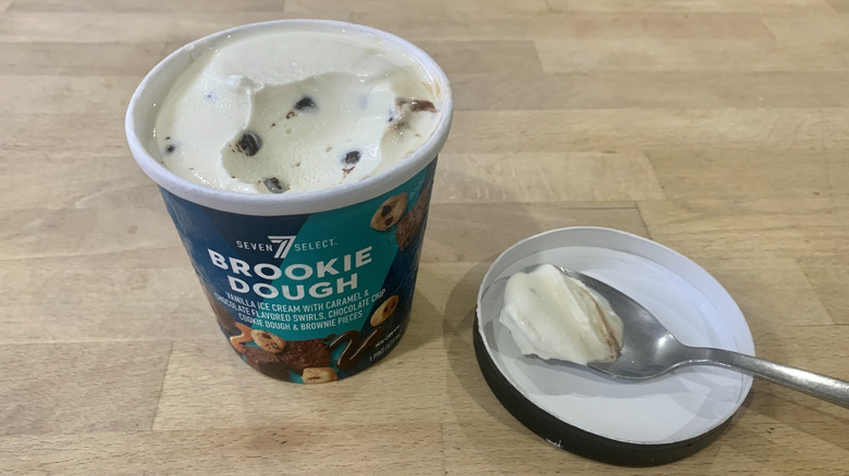 opened Brookie pint with spoonful of ice cream next to it