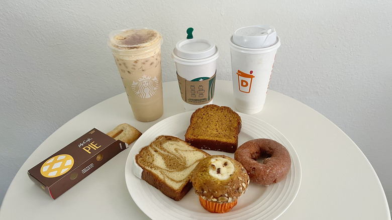 Several fast food pumpkin items on small white table