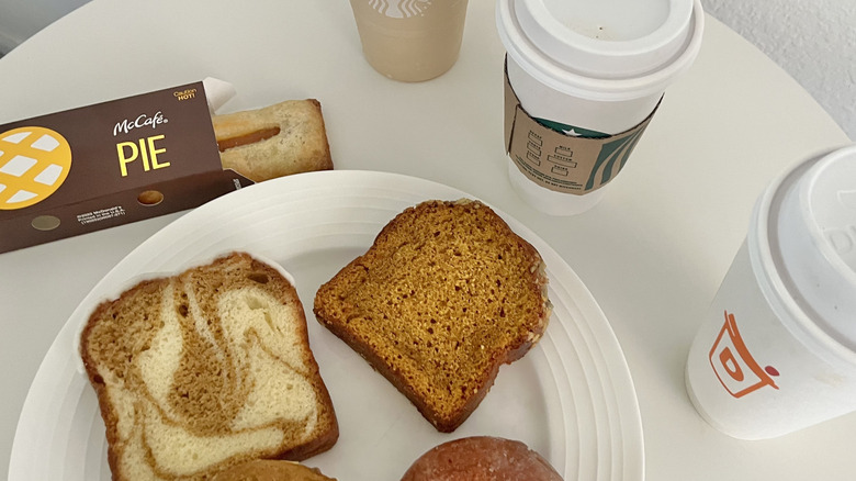Various fast food pumpkin items on a white table