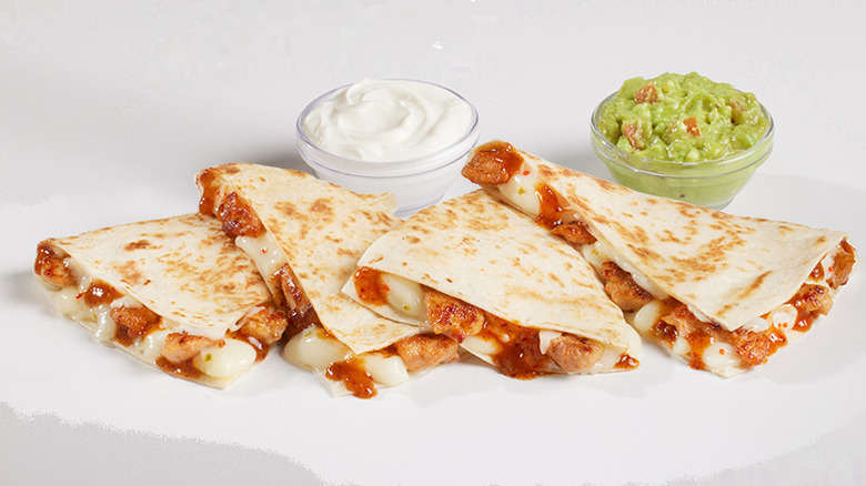 Del Taco Del Dorado Chicken quesadilla with sour cream and guacamole