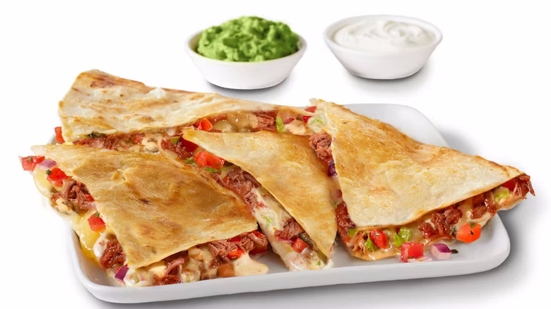 Qdoba QuesaBirria quesadilla with guacamole and sour cream