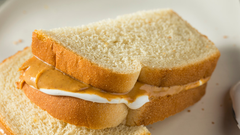 A sliced fluffernutter sandwich on a plate