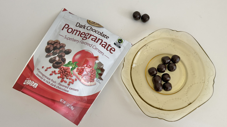 Several pieces of Choceur Pomegranate Dark Chocolate on a plate