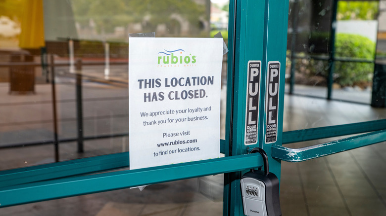 Close up of a closed sign on the door of a Rubio's restaurant