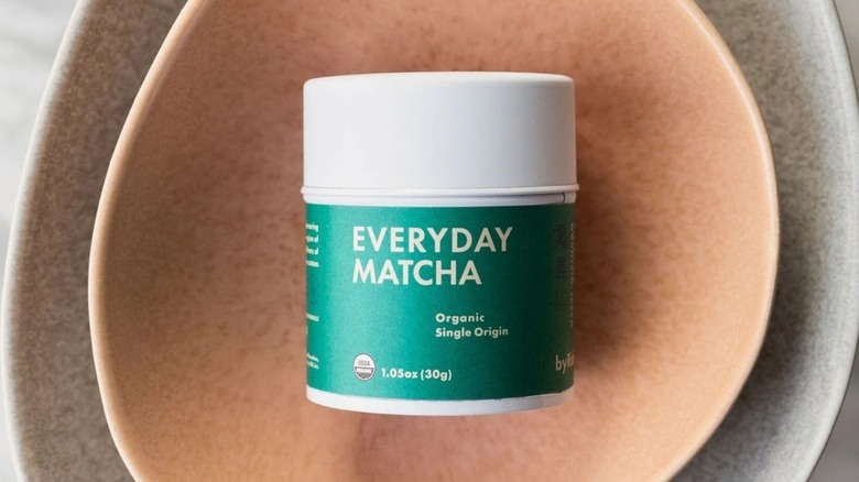 Overhead shot of Rishi everyday matcha container in two stacked bowls